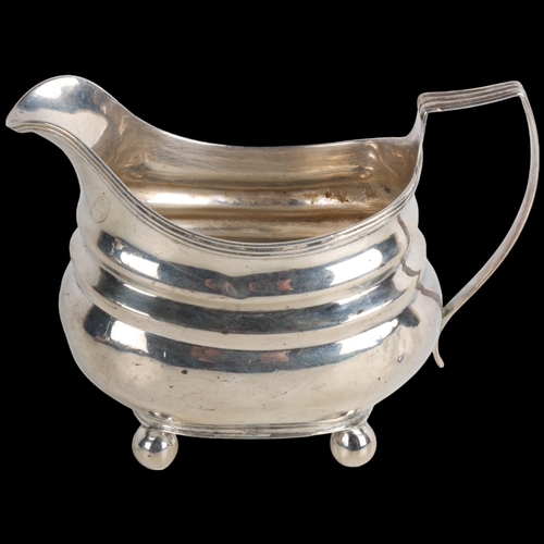 1954 - A George III silver cream jug, indistinct maker, London 1779, bulbous form with reeded rim and bun f... 