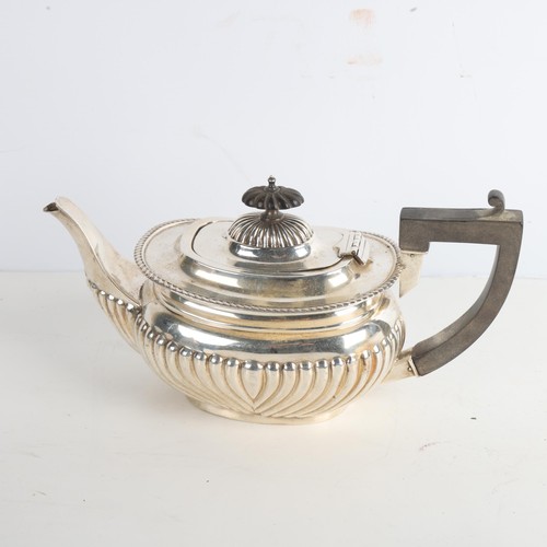 1968 - An Edwardian silver bachelor's teapot, William Aitken, Birmingham 1902, oval bulbous form with half ... 