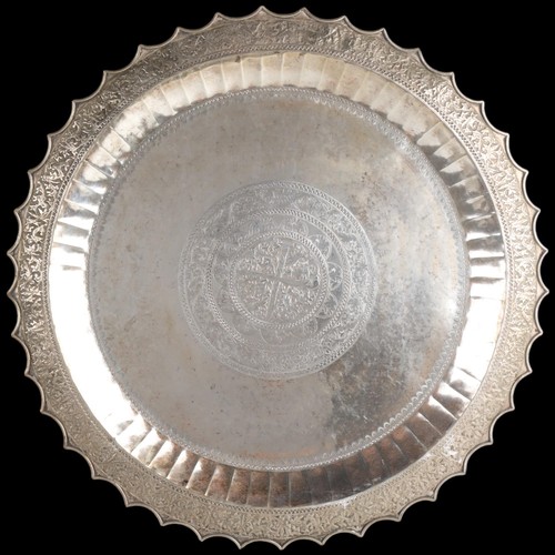 1970 - A large Malay silver platter tray, Malay Peninsular or Riau, 19th-early 20th century, with relief em... 