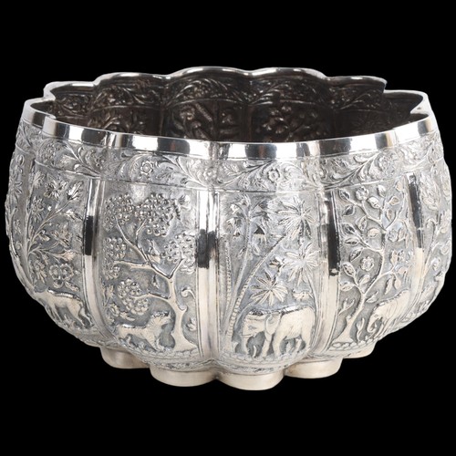 1971 - A fine quality Burmese silver Thabeik lobed rice bowl, early 20th century, with panels relief emboss... 