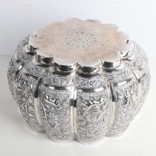 1971 - A fine quality Burmese silver Thabeik lobed rice bowl, early 20th century, with panels relief emboss... 