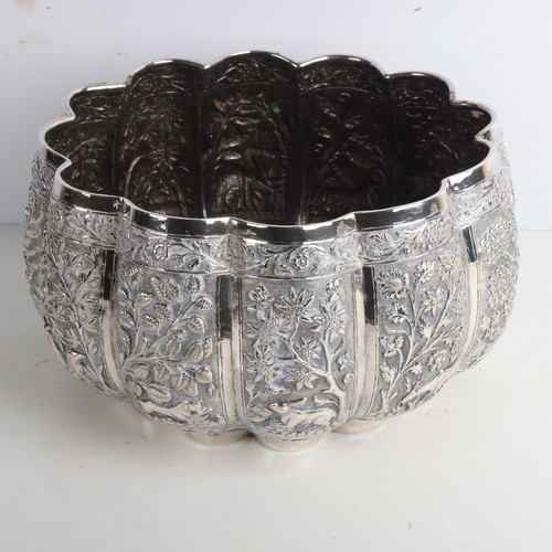 1971 - A fine quality Burmese silver Thabeik lobed rice bowl, early 20th century, with panels relief emboss... 