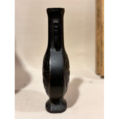 73 - A miniature Chinese patinated bronze vase, with relief cast decoration, height 10cm