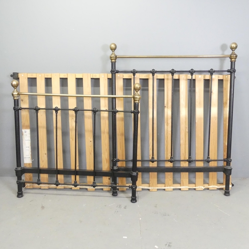 2643 - A painted iron and brass single bed. Headboard 102x128cm.