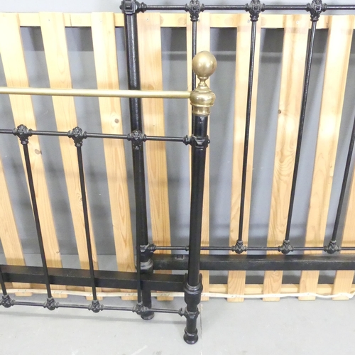 2643 - A painted iron and brass single bed. Headboard 102x128cm.