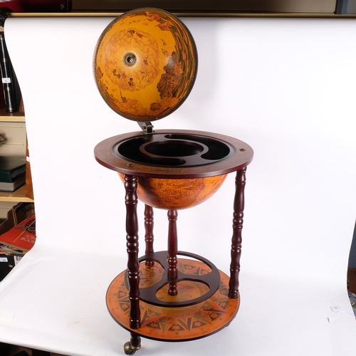 114 - A reproduction terrestrial globe drinks trolley, H93cm