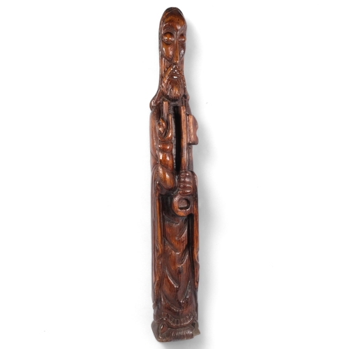 115 - A carved and stained pine study of St Peter, H92cm