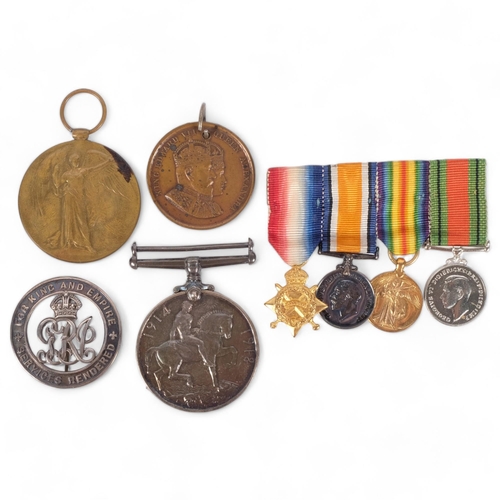 124 - A group of miniature First and Second World War medals, a First World War medal and Defence medal na... 