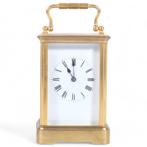 126 - A French brass-cased striking carriage clock, H11.5cm not including handle