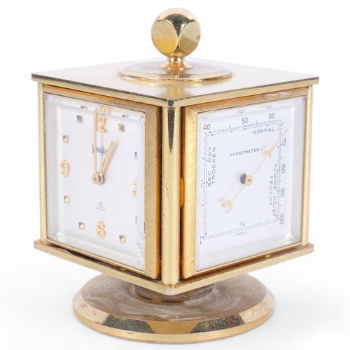 127 - Neiman-Marcus, a mid-century gilt desk clock and weather compendium, on revolving stand, Swiss-made ... 