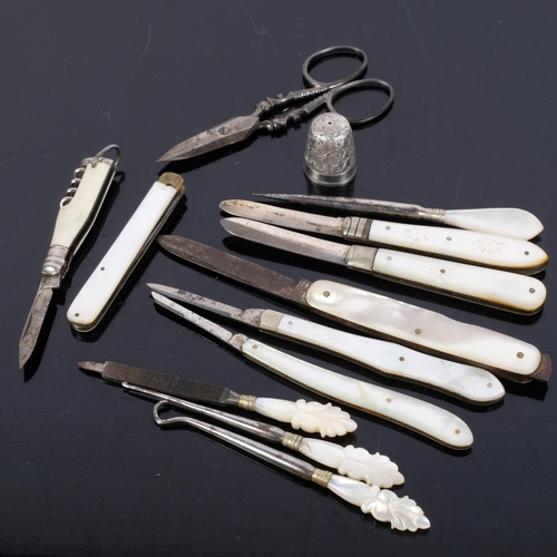 138 - A collection of mother-of-pearl handled fruit knives, some with silver blades, mother-of-pearl handl... 