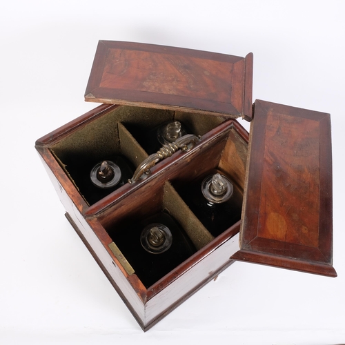 26 - A large George III mahogany 4-bottle decanter box, with 2 sliding lids and brass carrying handle, an... 