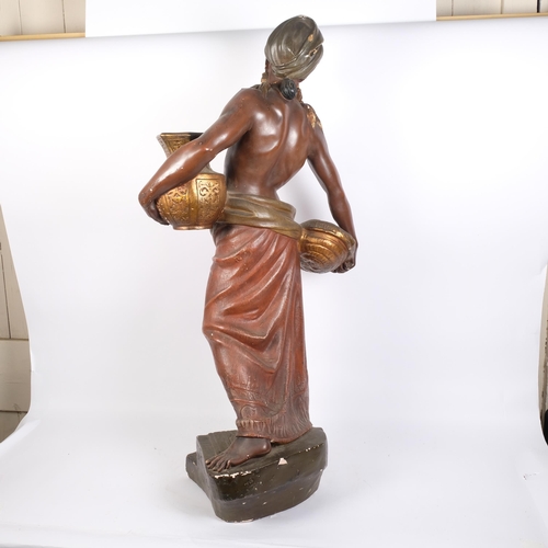 36 - An Antique painted plaster figure of a Blackamoor, stood on a stepped plinth base, signed F Koenig, ... 