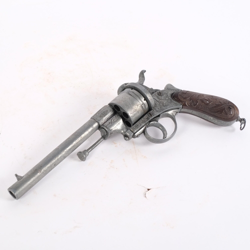 67 - A replica Belgian pinfire pistol, with leather holster and studded belt