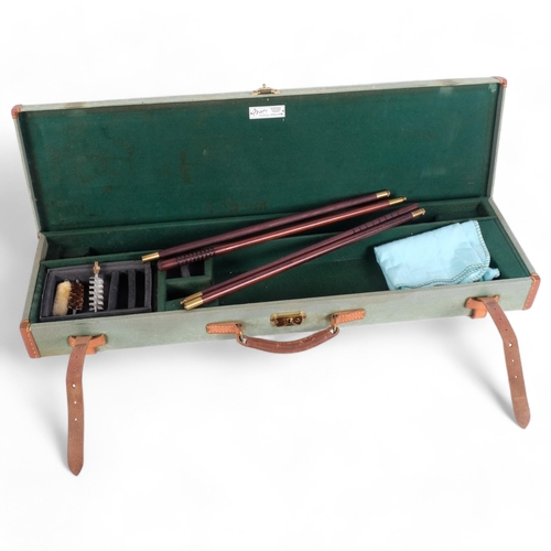 68 - A rectangular hard-bodied gun case, by Brady Sporting Goods, including some cleaning brushes, leathe... 