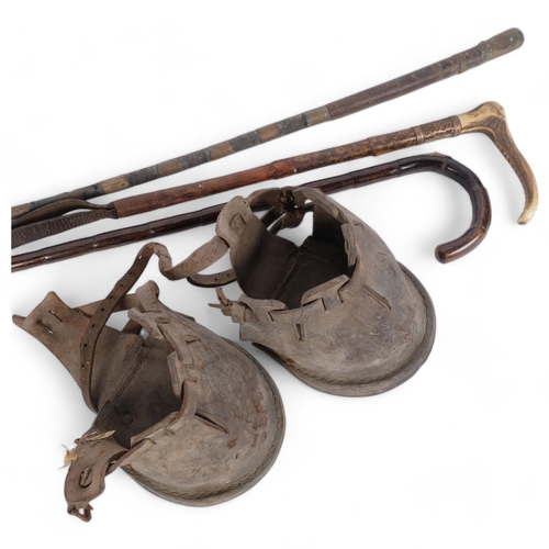 81 - A group of equine associated items, including a horse measuring walking cane, carriage whip, horn-ha... 