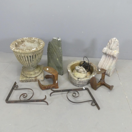 2619 - A weathered concrete garden urn with fluted decoration, 31x37cm, a pair of cobbler's anvils, etc.