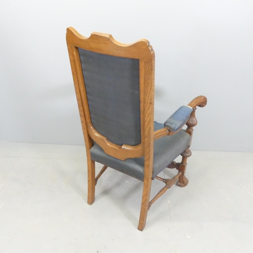 2633 - A 19th century style mahogany and upholstered open arm chair.