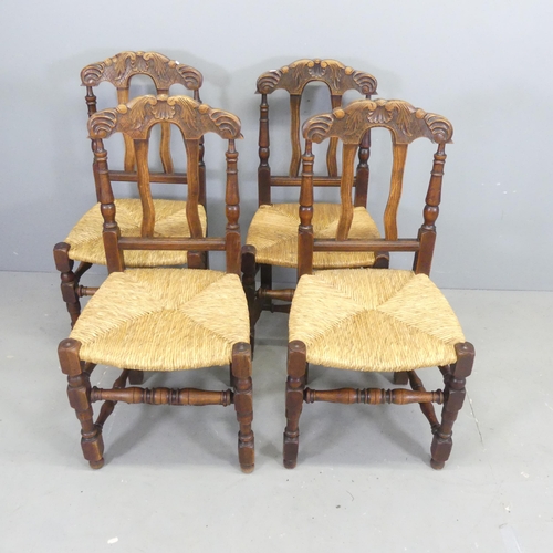 2634 - A set of four French oak rush-seated dining chairs.