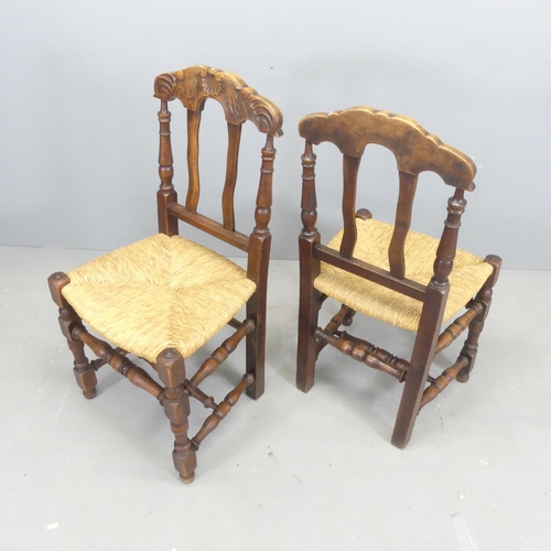 2634 - A set of four French oak rush-seated dining chairs.