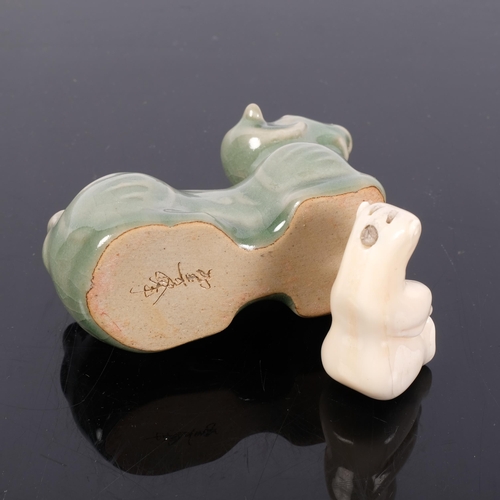 157 - A Chinese celadon study of a goat, and a Japanese polar bear netsuke (2)