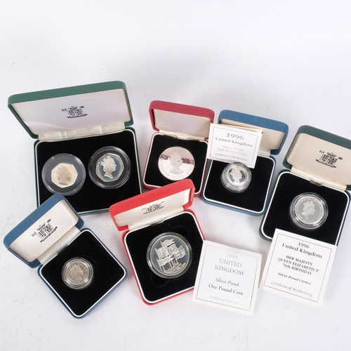 164 - A collection of silver proof coins, including 1996 and 1999 one pound coins, a 1997 silver proof 50p... 