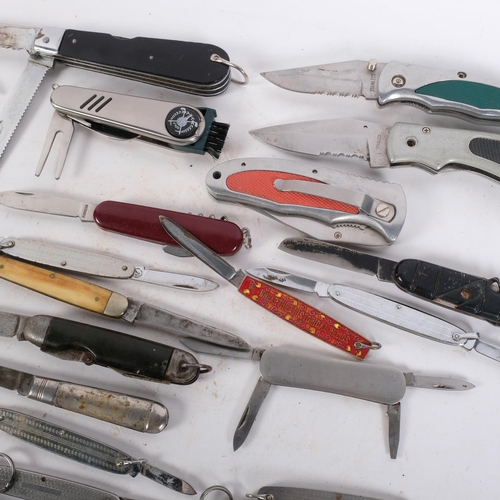 168 - A collection of various penknives, including a silver example