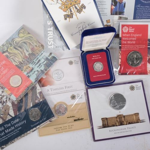 174 - A collection of silver commemorative coins, including a twenty pound Outbreak of the First World War... 