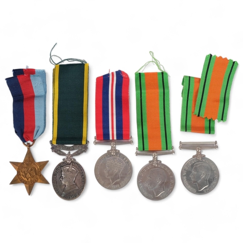 176 - A Second World War medal trio, awarded to Mr R J Spiers, all in original packing and boxed, a King G... 