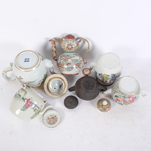 197 - A group of Oriental teapots, including a famille rose, a terracotta teapot, etc (6)