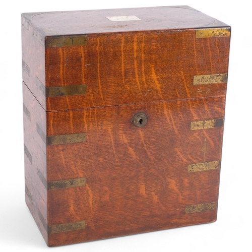 433 - A brass-bound oak decanter box, retailed by Army & Navy, H28cm