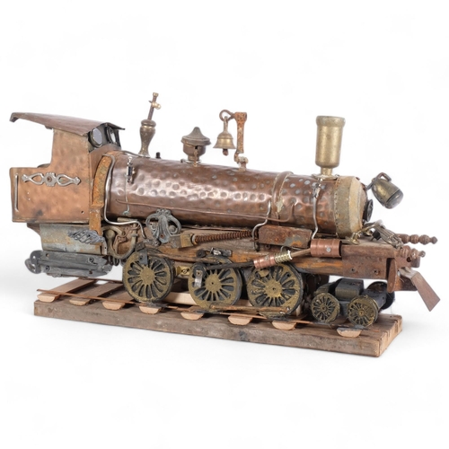 436 - Clive Fredriksson 2024, a copper and brass steampunk locomotive on wooden track, L66cm