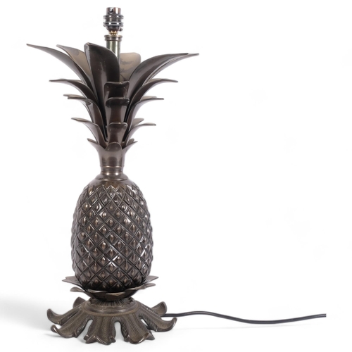 441 - A cast-bronze pineapple design table lamp, 52cm