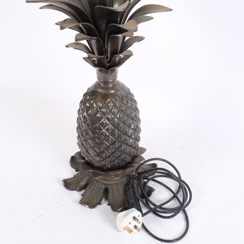 441 - A cast-bronze pineapple design table lamp, 52cm