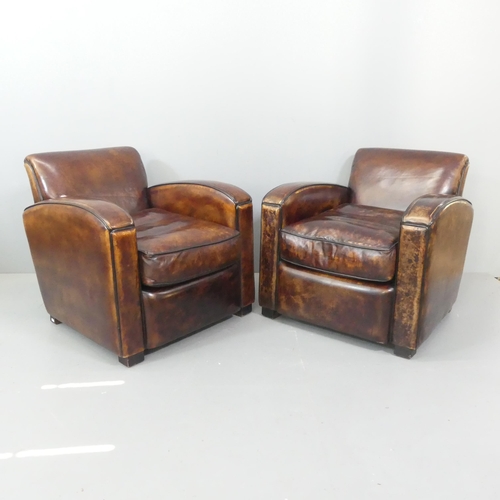 A pair of French Art Deco style leather club chairs in the manner of Jacques Adnet. Overall 75x73x85cm, seat 48x41x52cm.