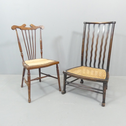 2660 - An Edwardian Arts & Crafts side chair, and a low wavy back cane-seated chair.