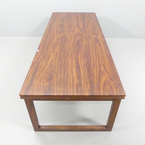 2662 - A mid-century modern Scandinavian design teak and rosewood-veneered coffee table, indistinctly marke... 