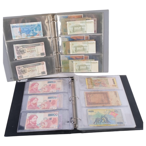 755 - 2 albums of various world banknotes, including Hong Kong