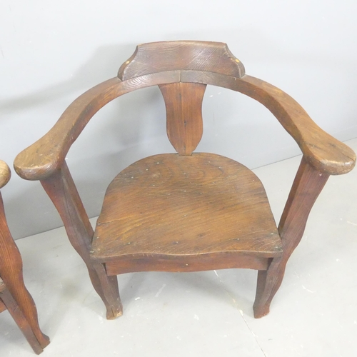 2650 - A pair of oak and pine bow-arm captain's chairs.