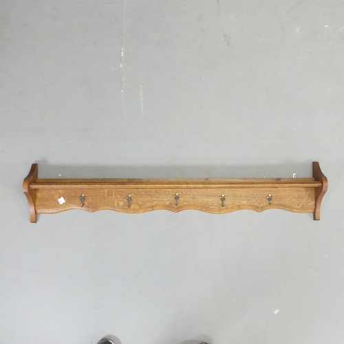 2652 - A French oak hanging pan / coat rack. Length 126cm.