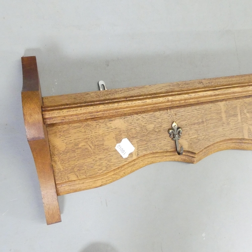 2652 - A French oak hanging pan / coat rack. Length 126cm.