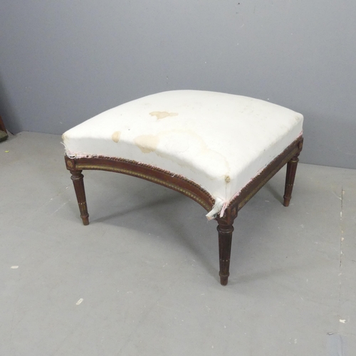 2657 - A French mahogany and upholstered concave footstool, for re-upholstery. 68x42x70cm.