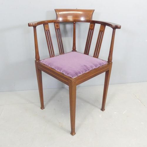 2659 - An Edwardian Arts & Crafts mahogany and satinwood strung bow-arm corner chair.