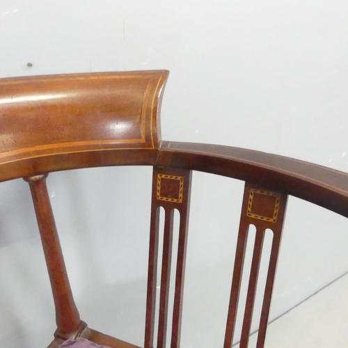 2659 - An Edwardian Arts & Crafts mahogany and satinwood strung bow-arm corner chair.