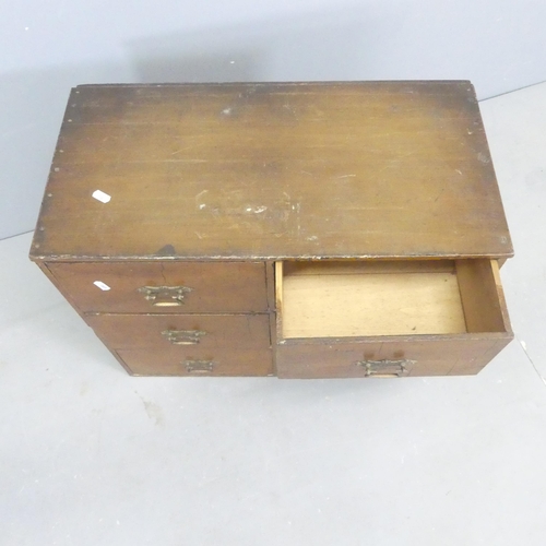 2667 - An early 20th century stained pine bank of six drawers. 61x49x31cm.