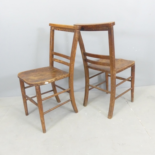 2669 - A pair of antique elm-seated chapel chairs.