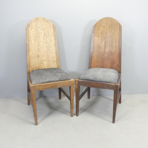 2670 - A pair of rustic Arts & Crafts style hardwood high back hall chairs, with butterfly cleated joints a... 