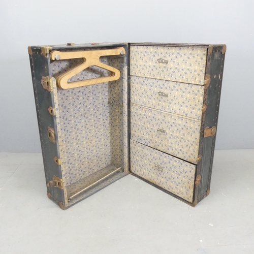 2676 - A vintage metal-bound travelling wardrobe, with label for Watajoy. Dimensons (closed) 37x93x56cm.... 