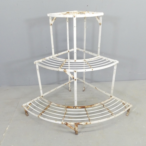 2678 - A painted metal corner three-tier plant stand. 85x75x62cm.