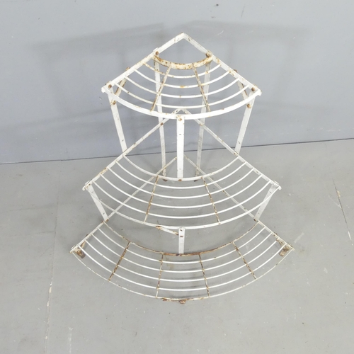 2678 - A painted metal corner three-tier plant stand. 85x75x62cm.